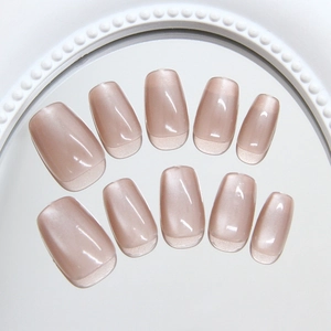 Brown cat eye press-on nails with sweet minimalist French style and glossy finish
