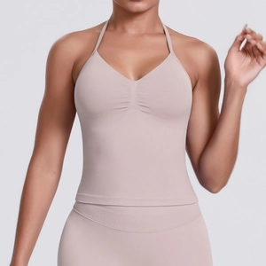Detail of light coffee seamless ribbed yoga top with halter neck and V-neck ruching design