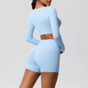 Detail view of light blue long sleeve crop top and high waist shorts gym set