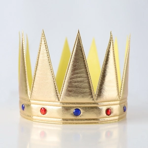 Golden fabric king crown cake topper with blue and red gemstone decorations for parties