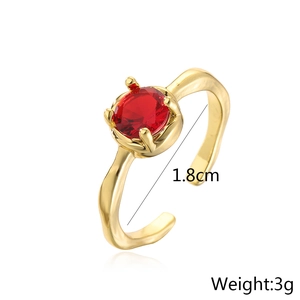 Detail view of gold-plated geometric ring with red zircon stone, 1.8cm diameter and 3g weight