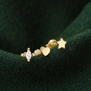 Detailed macro view of S925 sterling silver heart, star, and marquise zircon stud earring set
