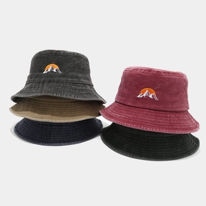 Embroidered sun and mountain bucket hats in five colors with washed cotton finish