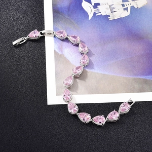 Sparkling pink pear-cut cubic zirconia bridal bracelet with a polished silver finish