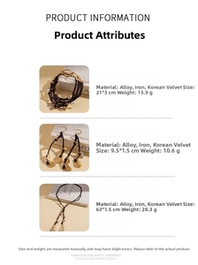 Détails du coffret bijoux avec pendentifs feuilles dorées et cordon marron tressé
