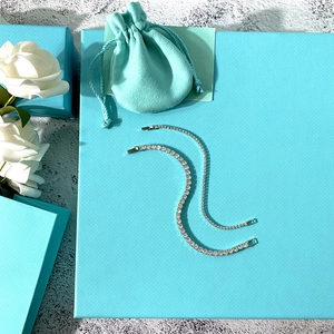 Sparkling silver tennis bracelet with 2mm zircon stones on mint blue gift box