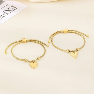Detail of 18K gold plated heart pendant snake chain bracelet with adjustable slider