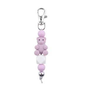 Close-up of purple silicone beads and cartoon bear charm keychain with silver metal clasp