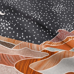 Detailed macro view showing the fabric texture and moon star print of the tapestry