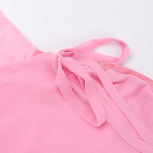 Detailed view of adjustable shoulder ties on pink ruffled slit dress in soft chiffon