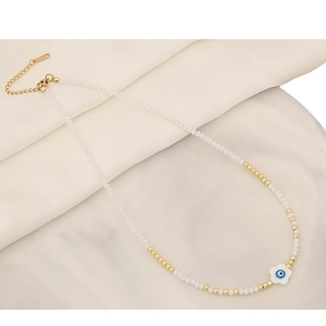 White beaded necklace featuring devil eye flower pendant and gold metallic accents