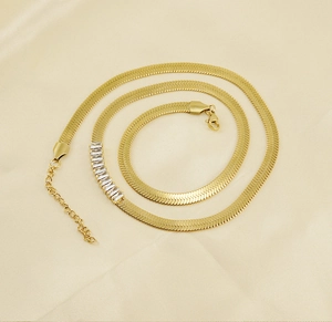 Close-up of 18K gold plated snake chain necklace with rectangular zircon stones