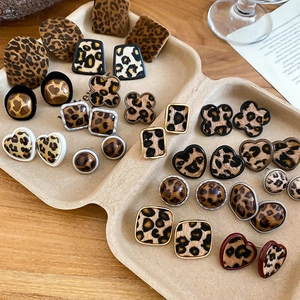Detailed macro shot of vintage leopard print geometric earrings in various shapes