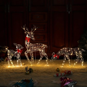 Detaillierte Ansicht von drei LED-Weihnachtsrentieren mit warmem Licht und roten Schleifen