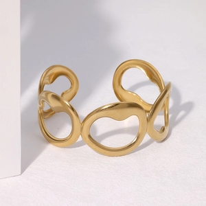 Minimalist hollow gold titanium steel open cuff bracelet with irregular organic design