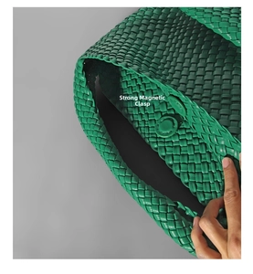 Close-up of green woven leather bucket bag featuring a secure magnetic clasp closure