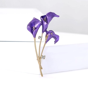 Close-up of purple enamel tulip brooch with gold stems and sparkling crystal stones