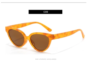 Close-up of tortoise shell cat eye sunglasses with brown lenses in high gloss finish