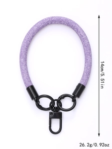 Detailed view of purple woven phone wrist strap with metal hook, 14cm length and 26.2g weight