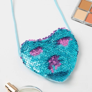 Detailed view of blue sequin heart-shaped mini purse with purple accents and long strap
