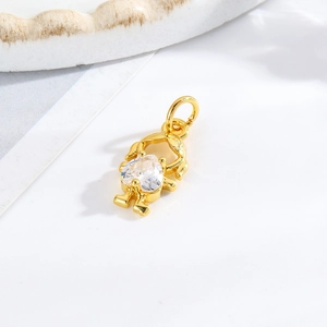 Detailed view of a gold girl pendant featuring a heart-shaped cubic zirconia gemstone