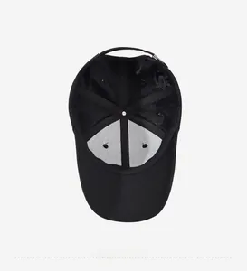 Detail view of black cotton baseball cap interior with reinforced seams and sweatband