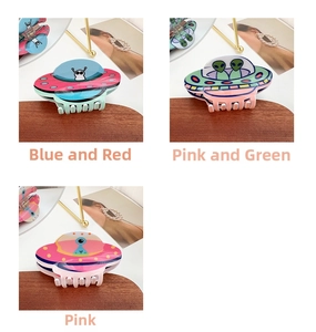 Detailed views of acrylic UFO alien claw clips in blue, pink, and green colorways