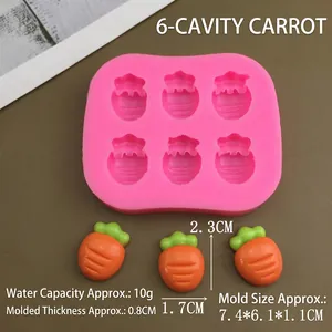 Macro detail of a 6-cavity pink silicone mold and carrot-shaped resin cake decorations