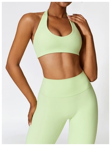Lime green two-piece yoga set featuring a halter crop top and high-waist leggings