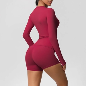 Detail of burgundy high-elastic yoga set showing seamless fabric and push-up shorts fit