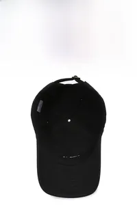 Detail view of the black cotton baseball cap interior featuring reinforced stitching and adjustable metal buckle