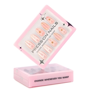 3D floral press-on nails with pearl pink glitter finish and white embossed petal details