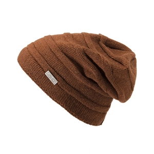 Close-up of caramel knit beanie texture and silver metal FASHION brand tag