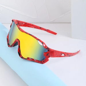 Detail of red splattered texture frame and yellow-blue gradient cycling sunglasses lenses