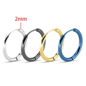 Macro detail of 2mm thick stainless steel hoop earrings in silver, black, gold and blue