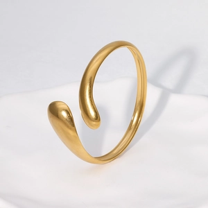 Minimalist 18k gold plated stainless steel open bangle featuring polished teardrop ends