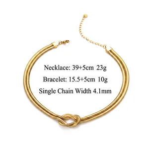 Double layered 18K gold plated snake chain necklace with knot detail in titanium steel