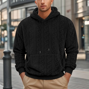 Detail of men's black teddy fleece hoodie featuring premium textured cable knit fabric
