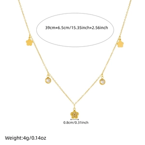Gold necklace with flower pendant and sparkling zircons on white background