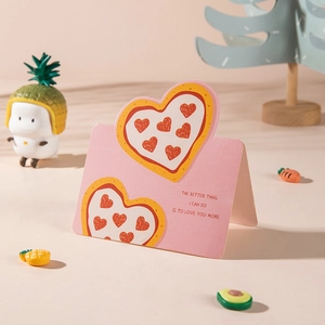 Pink greeting card featuring heart pizza design with a romantic English message