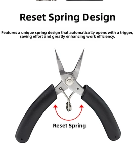 Detail of jewelry needle nose pliers with ergonomic black handle and reset spring