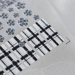 Classic black and white checkered nail stickers with camellia flower embossed textures