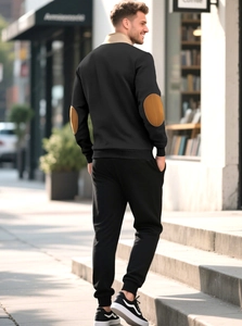 Detail view of men's casual black sweatshirt with contrasting brown elbow patches back view