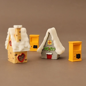 Miniature Christmas snow houses and yellow mailboxes decoration for holiday scenery