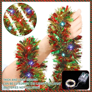 Thick Christmas tinsel garland with LED lights in red, green and gold festive colors