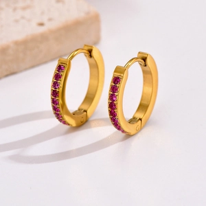 Gold stainless steel hoop earrings with a vertical row of sparkling pink zircons
