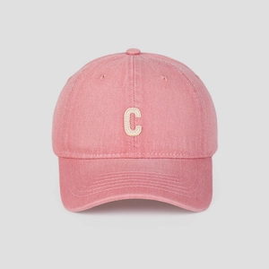 Close-up of pink washed cotton baseball cap featuring ivory letter C applique embroidery