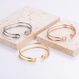 Modern minimalist geometric safety pin open cuff bracelet set in gold, silver, and rose gold
