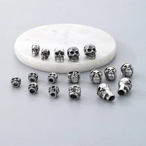 Macro detail of vintage silver stainless steel skull beads for DIY jewelry making