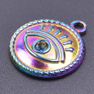 Macro shot of colorful iridescent evil eye pendant with rope edge for jewelry making